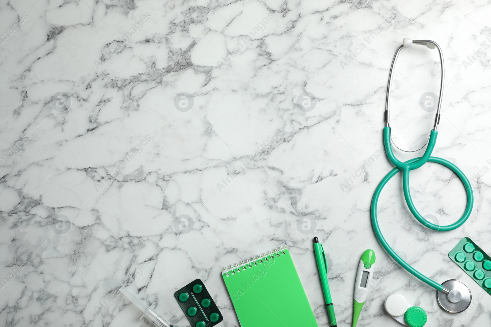 Photo of Flat lay composition with medical objects and space for text on marble background