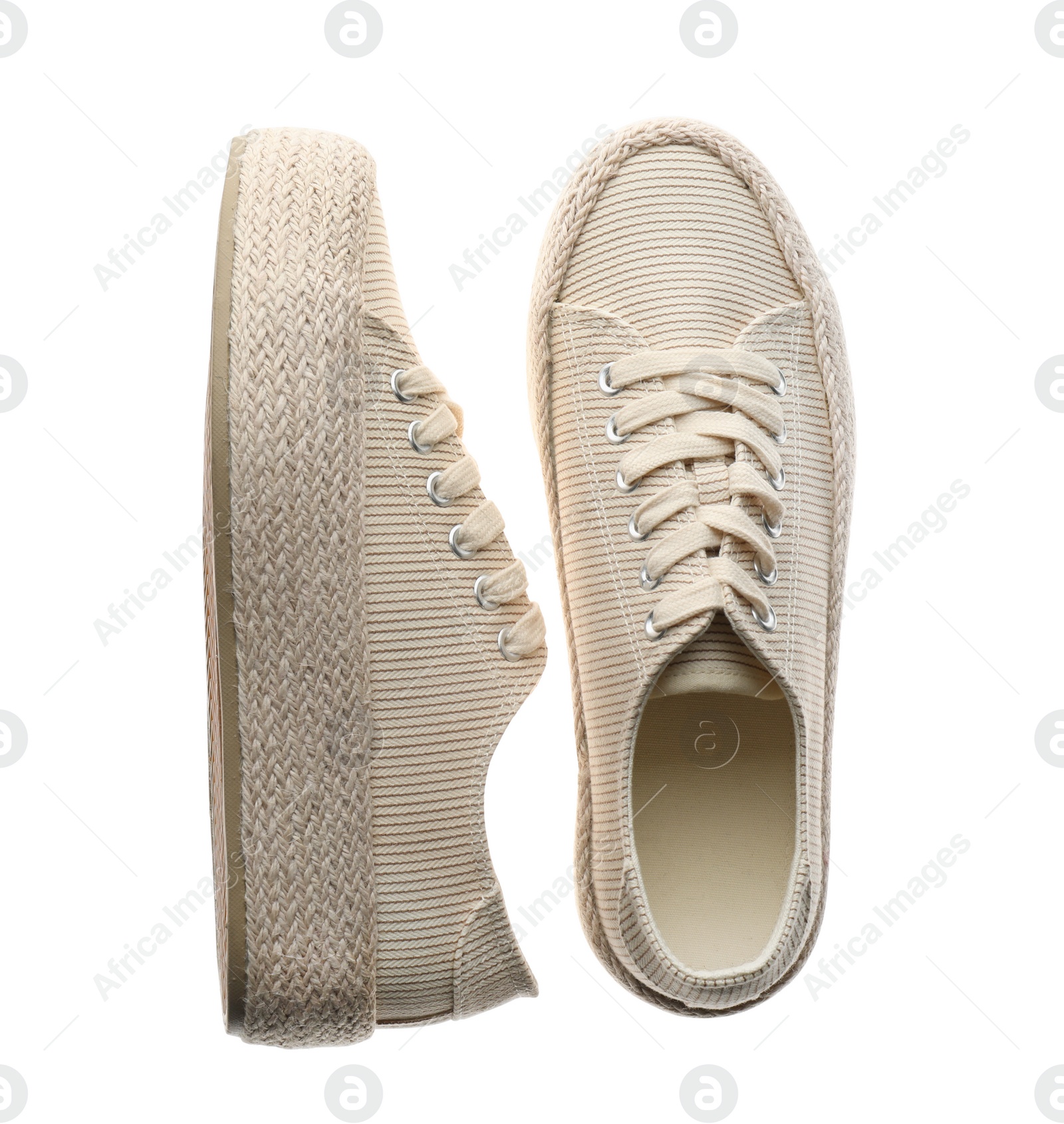 Photo of Pair of stylish sneakers on white background, top view