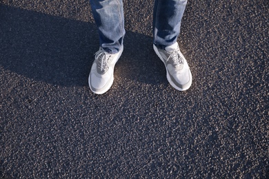Photo of Man standing on road, closeup with space for text. Choosing way concept