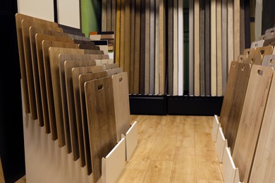 Photo of Many different samples of wooden flooring in store