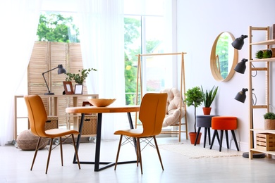 Photo of Modern dining room interior with table and chairs