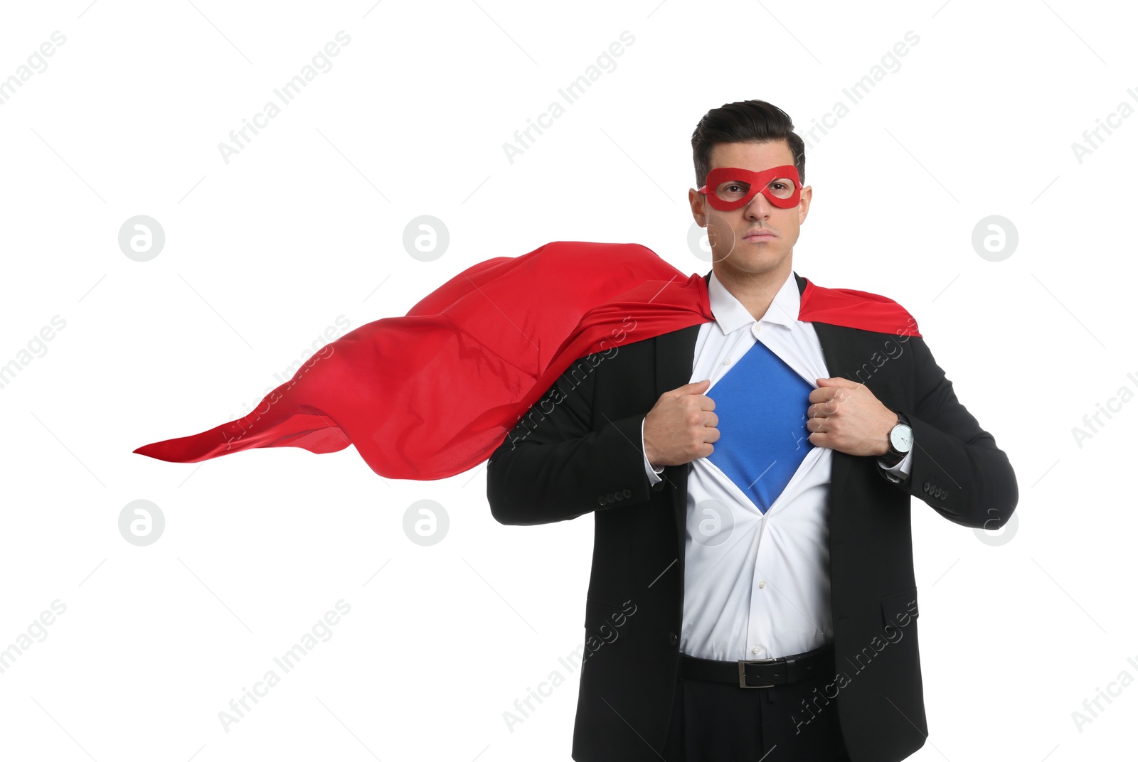 Photo of Businessman in superhero cape and mask taking suit off on white background