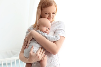 Happy mother and her baby at home