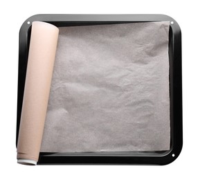 Photo of Baking pan with roll of parchment paper isolated on white, top view