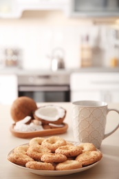 Plate with cookies on wooden table