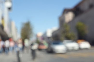 Photo of Blurred view of people on city street. Bokeh effect