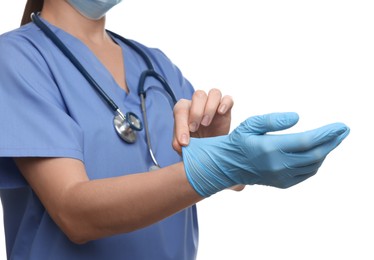 Doctor wearing light blue medical glove on white background, closeup