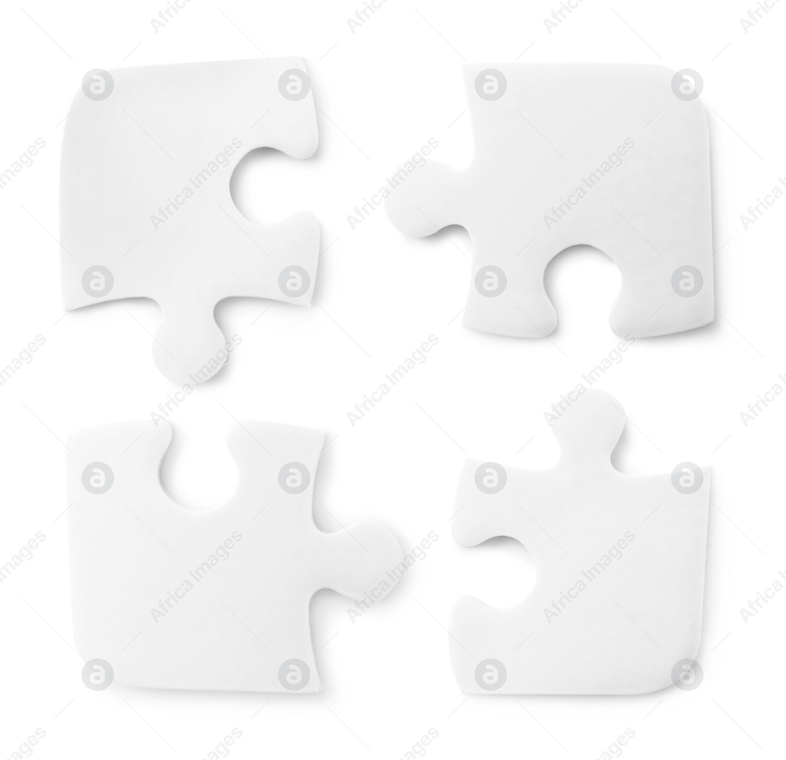 Image of Set with jigsaw puzzle pieces on white background, top view