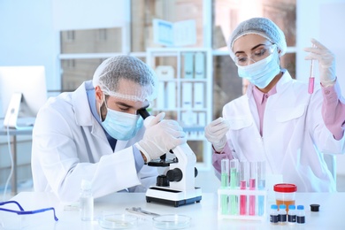 Young scientists working in laboratory. Chemical analysis