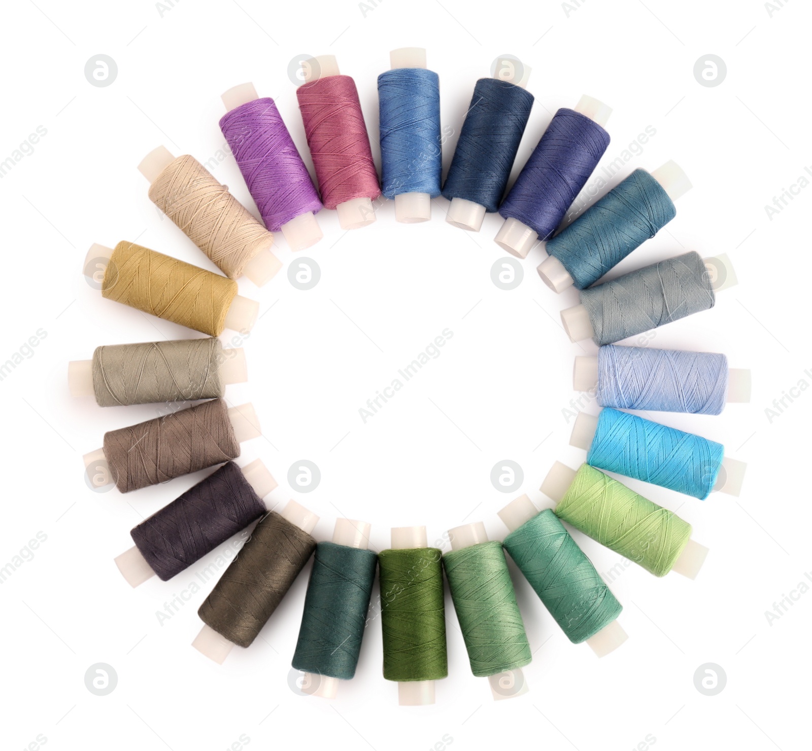 Photo of Frame of colorful sewing threads on white background, top view. Space for text