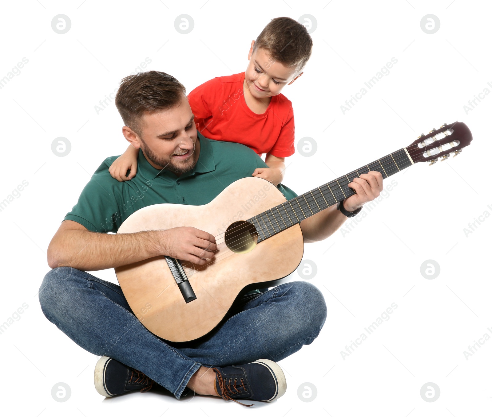 Photo of Father playing guitar for his son on white background