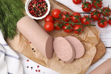 Delicious liver sausages and other products on white wooden table, flat lay