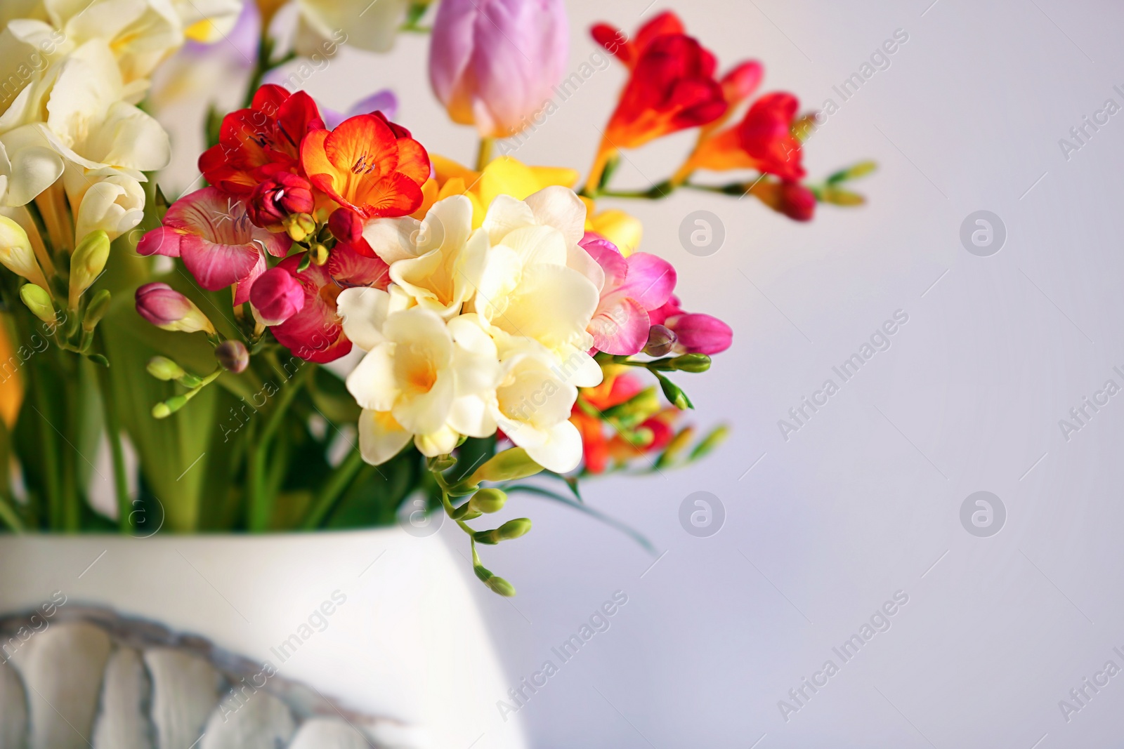 Photo of Beautiful bouquet of freesia flowers, closeup