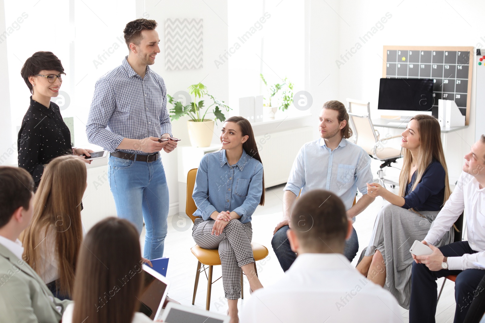 Photo of Young people having business training in office