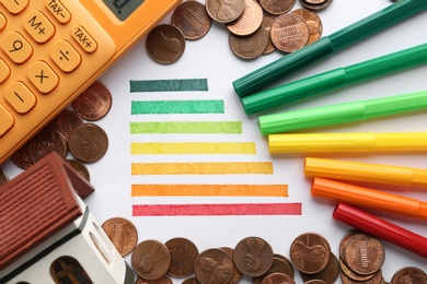 Photo of Flat lay composition with colorful chart and money on white background. Energy efficiency concept
