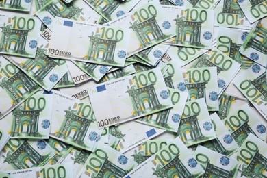 Photo of 100 Euro banknotes as background, top view. Money exchange