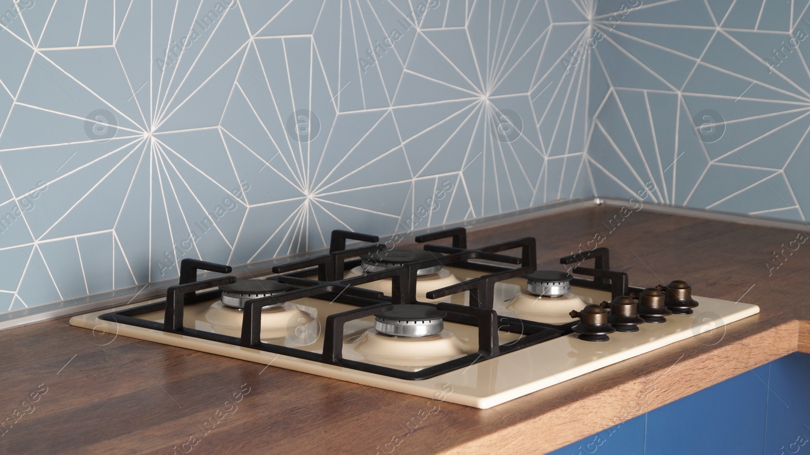 Photo of Modern gas cooktop in kitchen. Cooking appliance