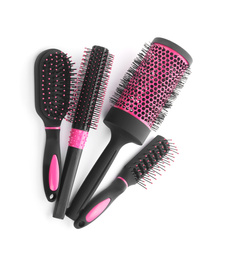 Photo of Set of professional hair brushes isolated on white