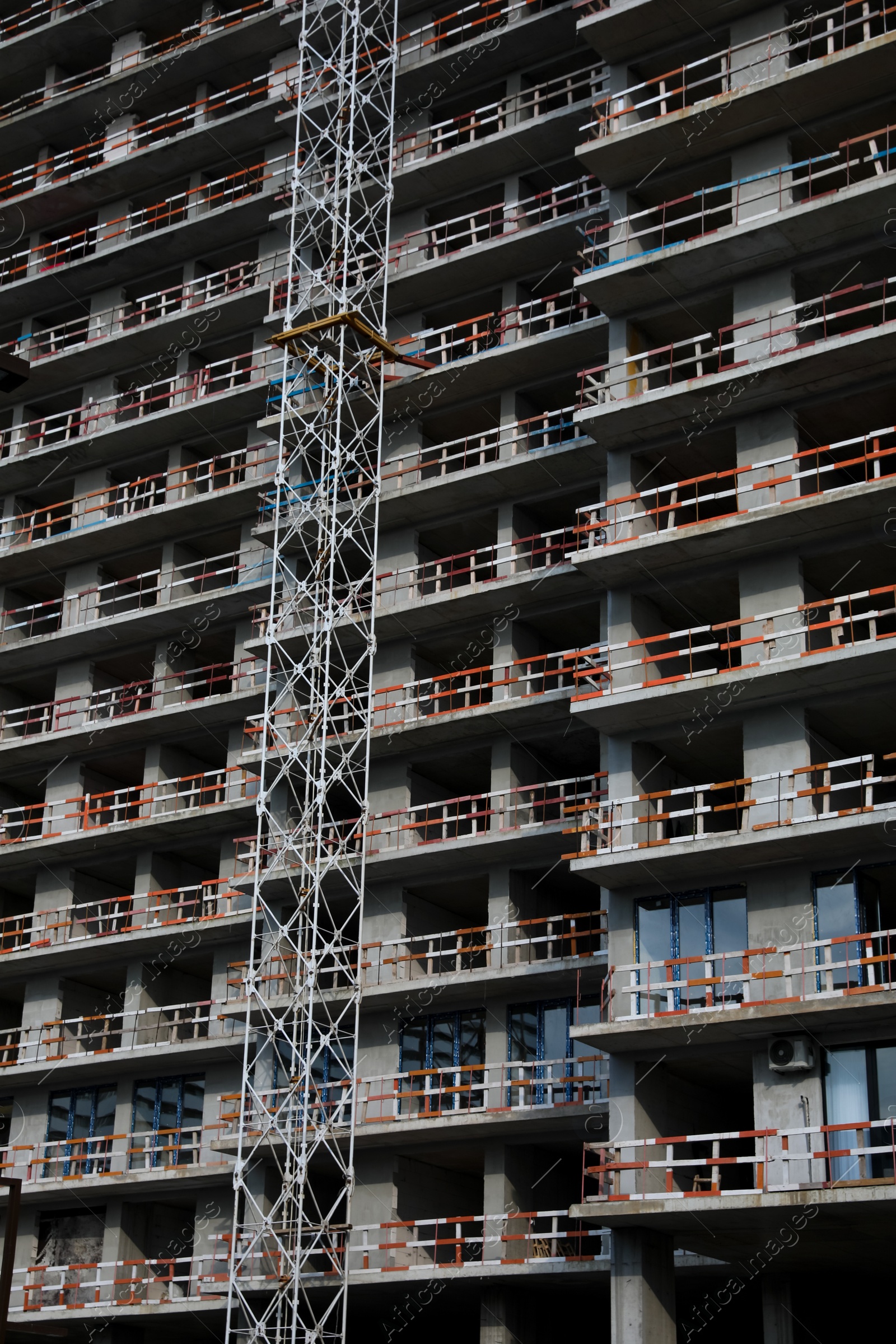 Photo of Construction site with unfinished residential building outdoors