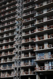 Construction site with unfinished residential building outdoors