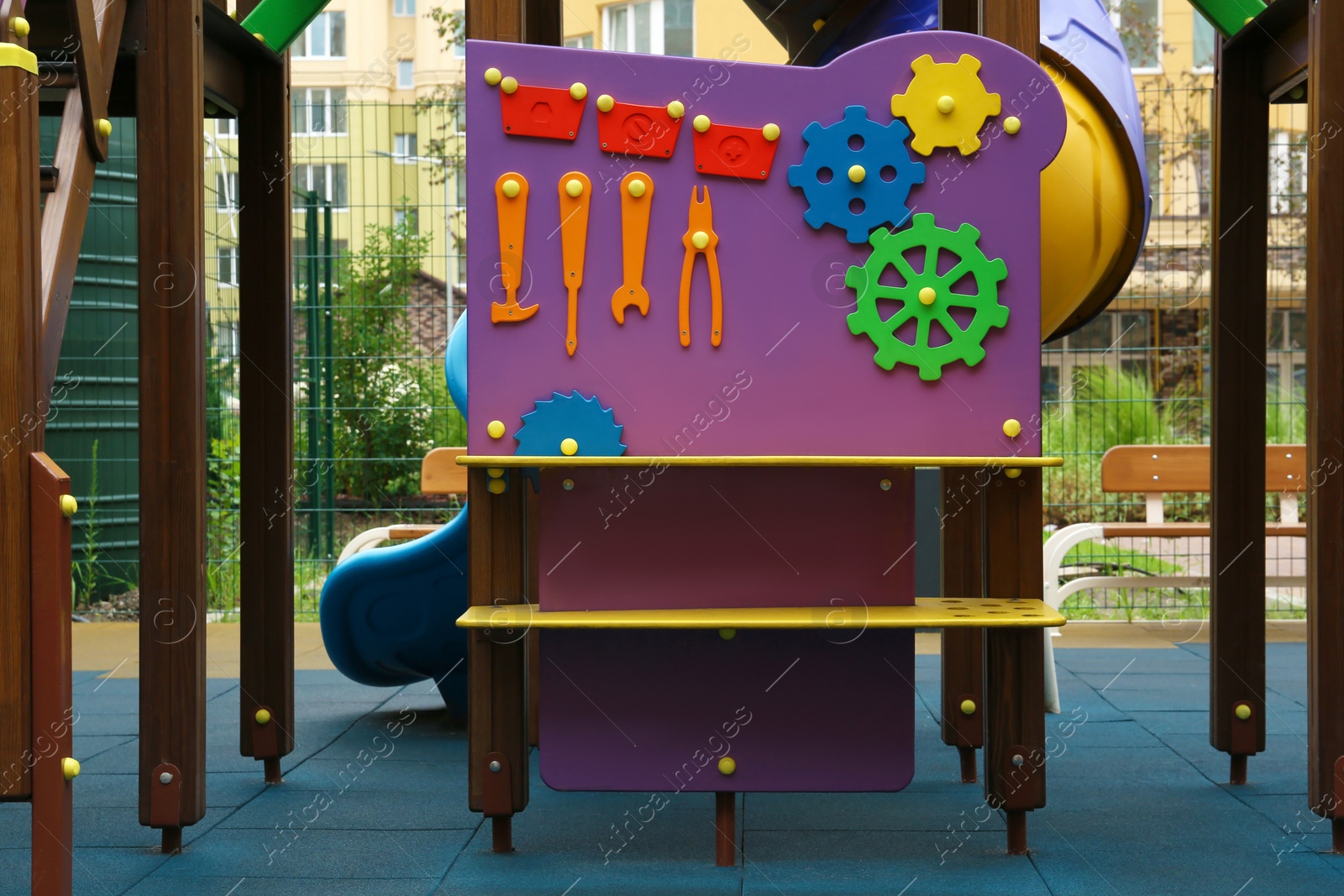 Photo of Colourful busy board on outdoor playground in residential area