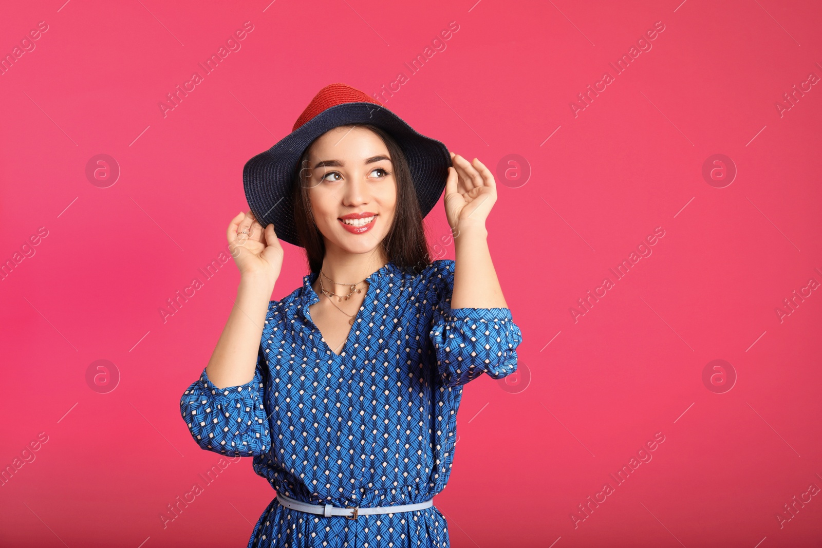 Photo of Portrait of beautiful young woman in stylish dress on color background. Space for text