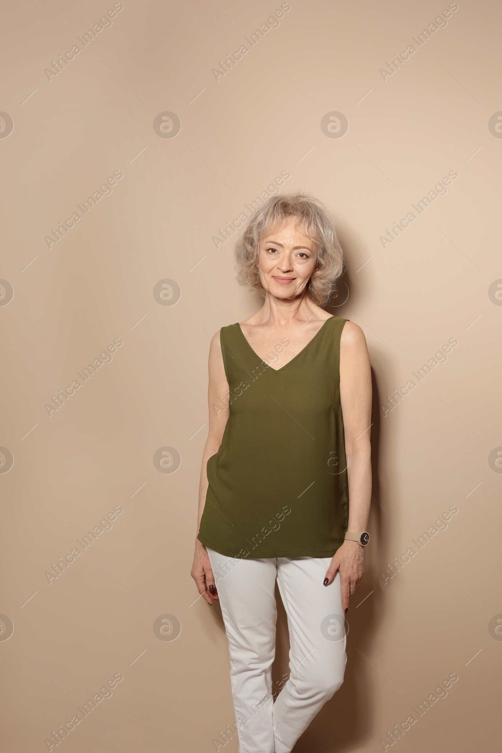 Photo of Portrait of mature woman on color background