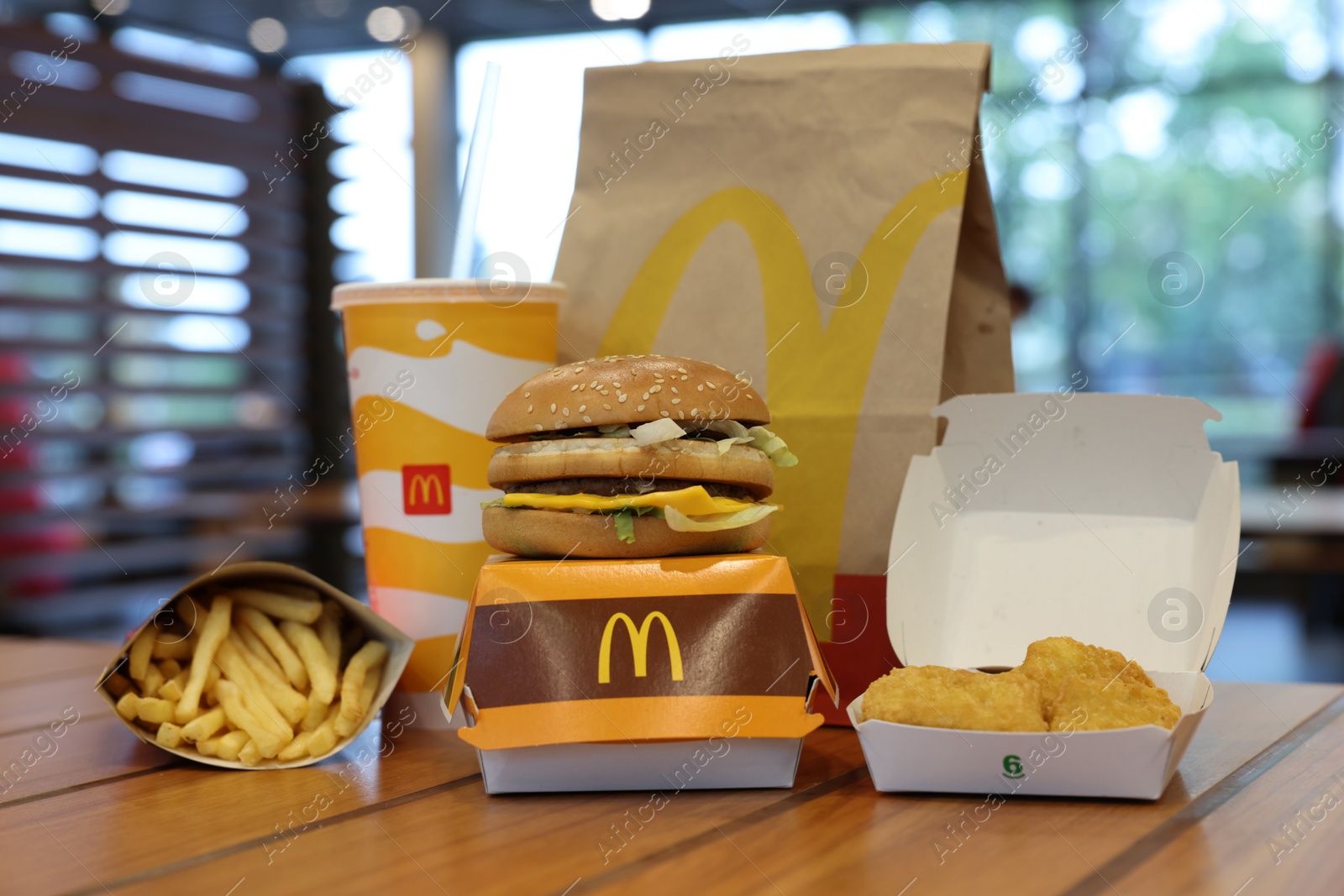 Photo of Lviv, Ukraine - October 9, 2023: McDonald's menu on wooden table in restaurant