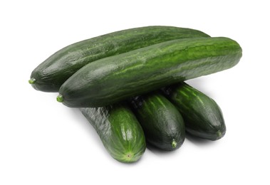 Photo of Many long fresh cucumbers isolated on white