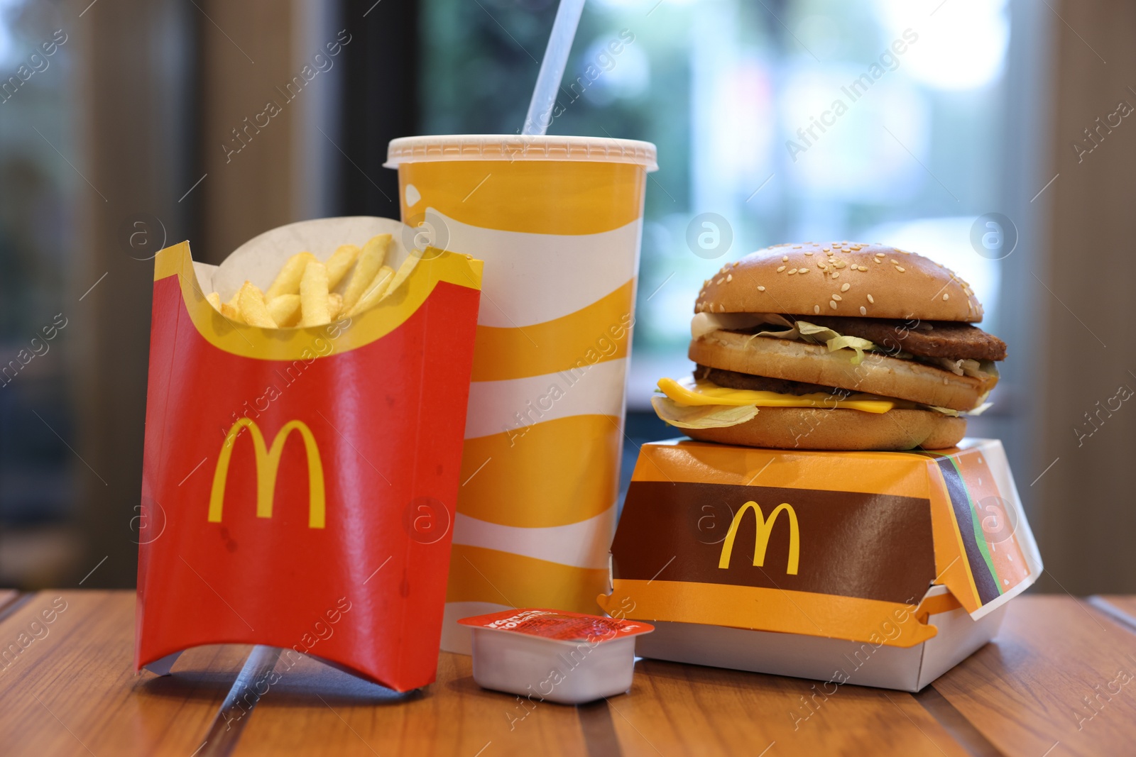 Photo of Lviv, Ukraine - October 9, 2023: McDonald's menu on wooden table in restaurant