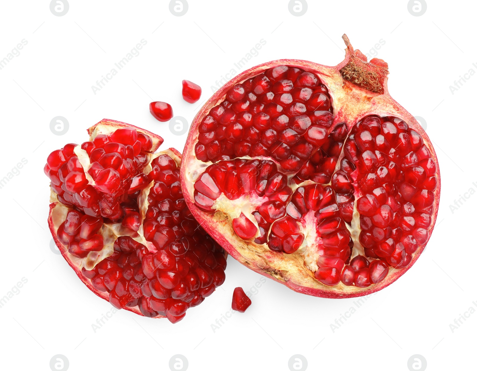 Photo of Fresh cut pomegranate isolated on white, top view