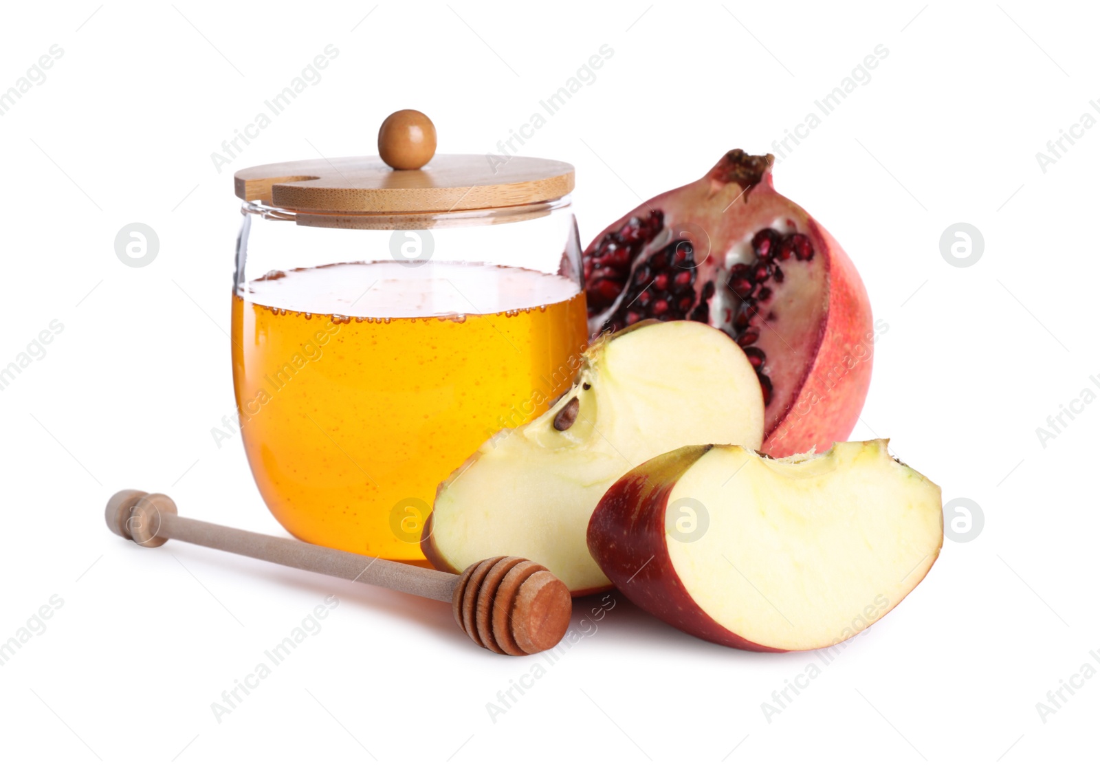 Photo of Honey, apple slices and pomegranate on white background. Rosh Hashanah holiday