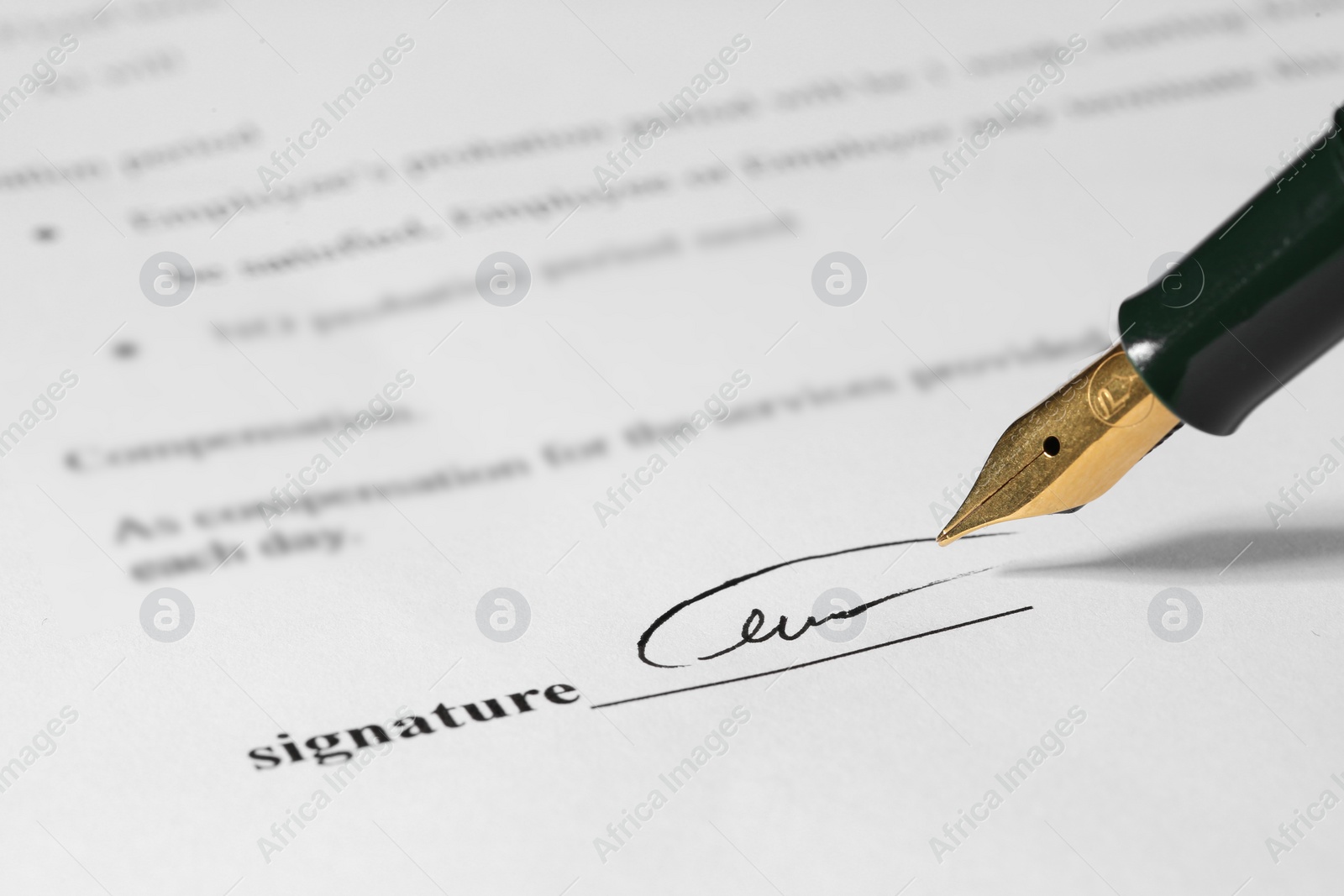 Photo of Signing notary document with fountain pen, closeup. Space for text