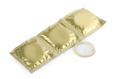 Photo of Packages and unpacked condom isolated on white. Safe sex
