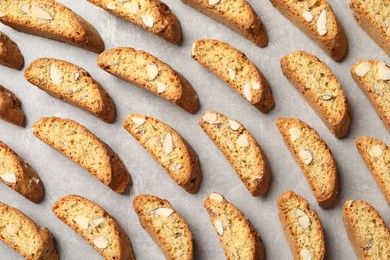 Photo of Traditional Italian almond biscuits (Cantucci) on light table, flat lay