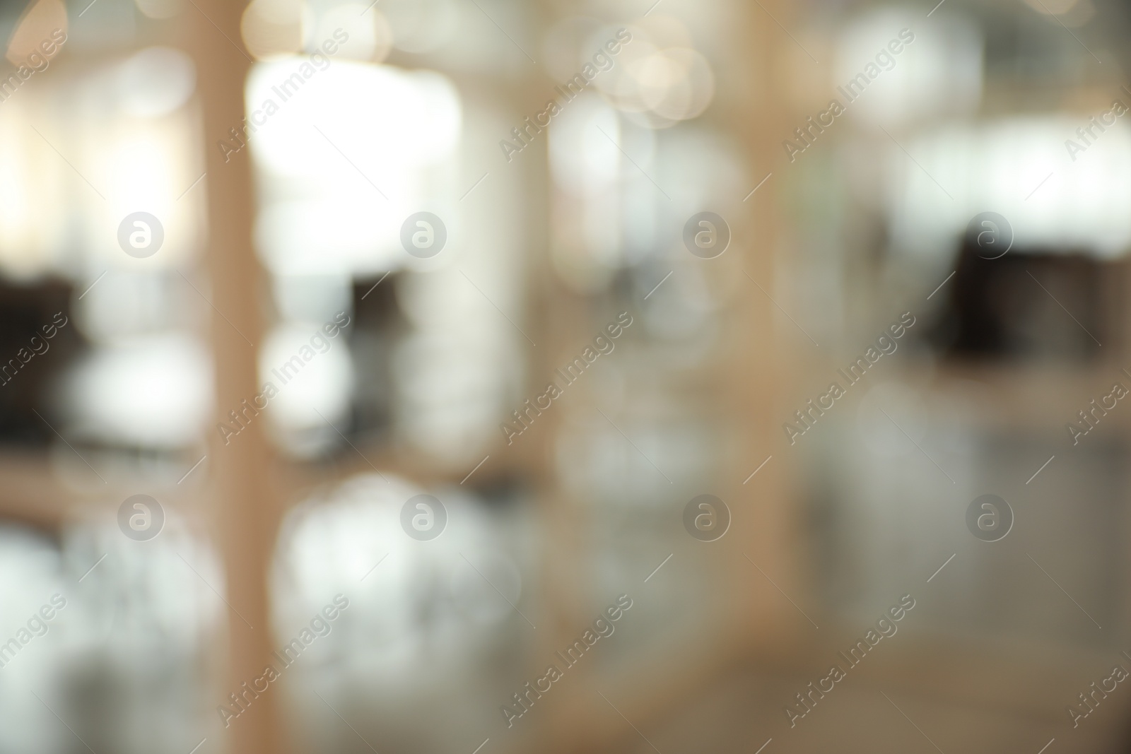 Photo of Blurred view of empty conference room and glass door in office