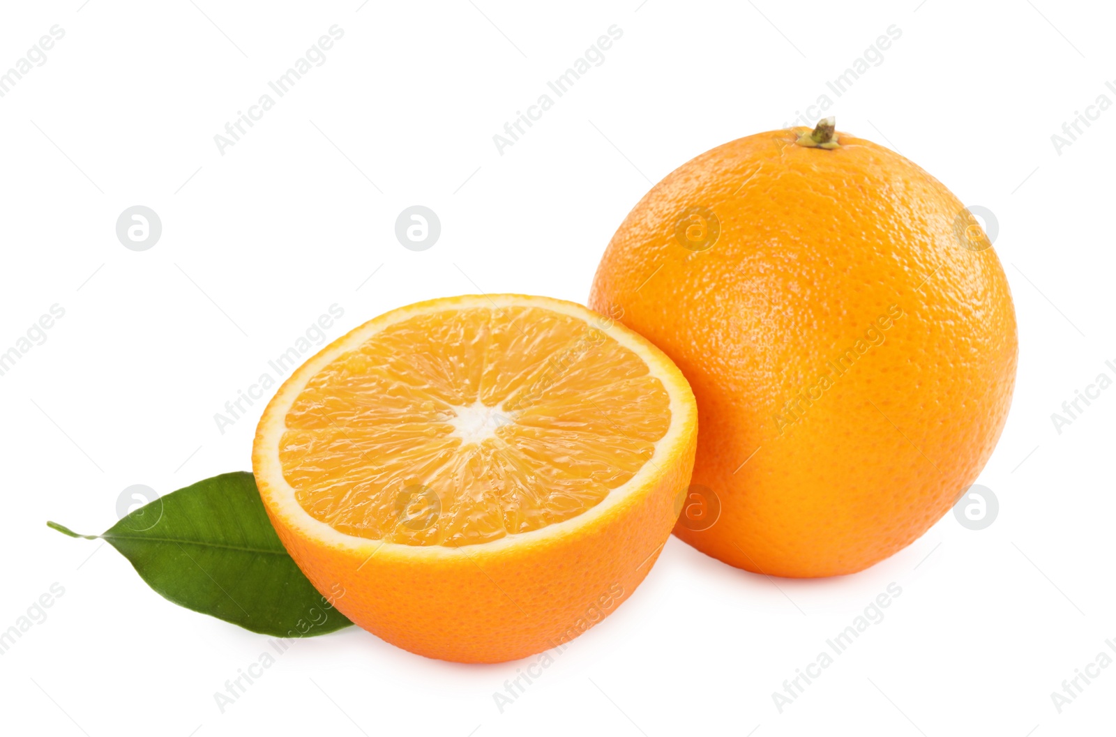 Photo of Whole and cut ripe oranges isolated on white