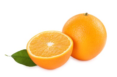 Photo of Whole and cut ripe oranges isolated on white