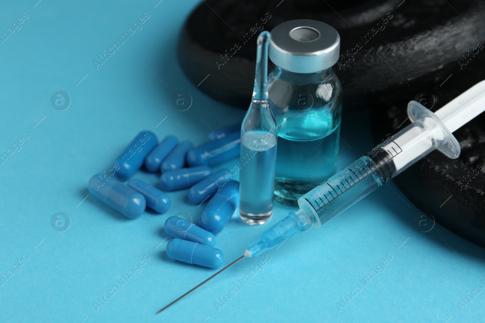 Photo of Different drugs and sports equipment on turquoise background, closeup. Doping control