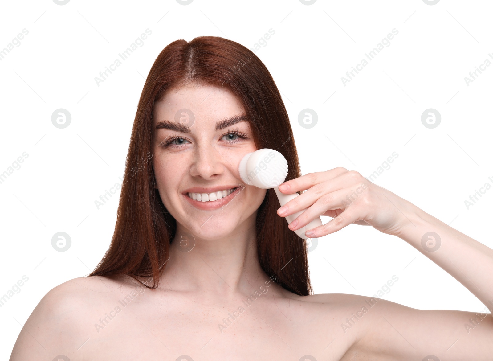 Photo of Washing face. Young woman with cleansing brush on white background