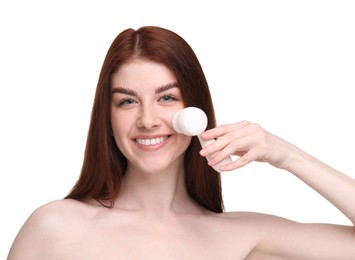 Washing face. Young woman with cleansing brush on white background