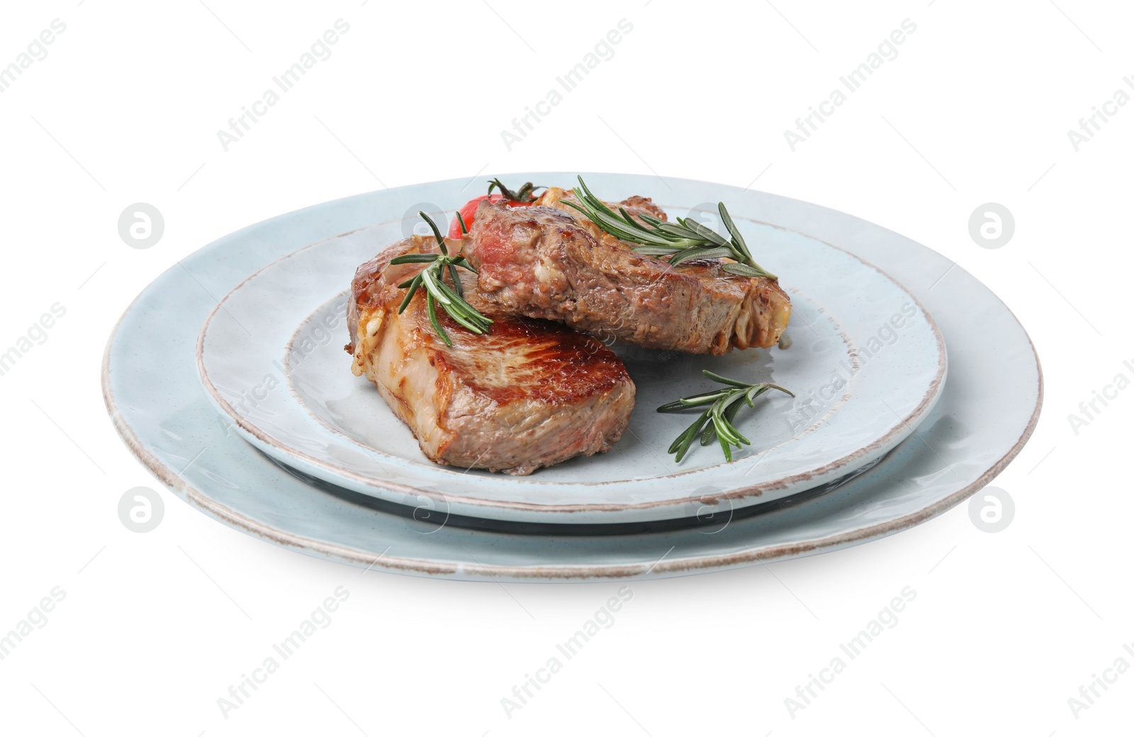 Photo of Plate of delicious fried meat with rosemary and tomato isolated on white