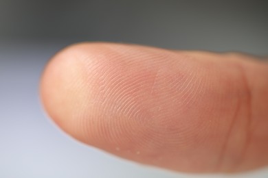 Closeup view of woman's finger on blurred background