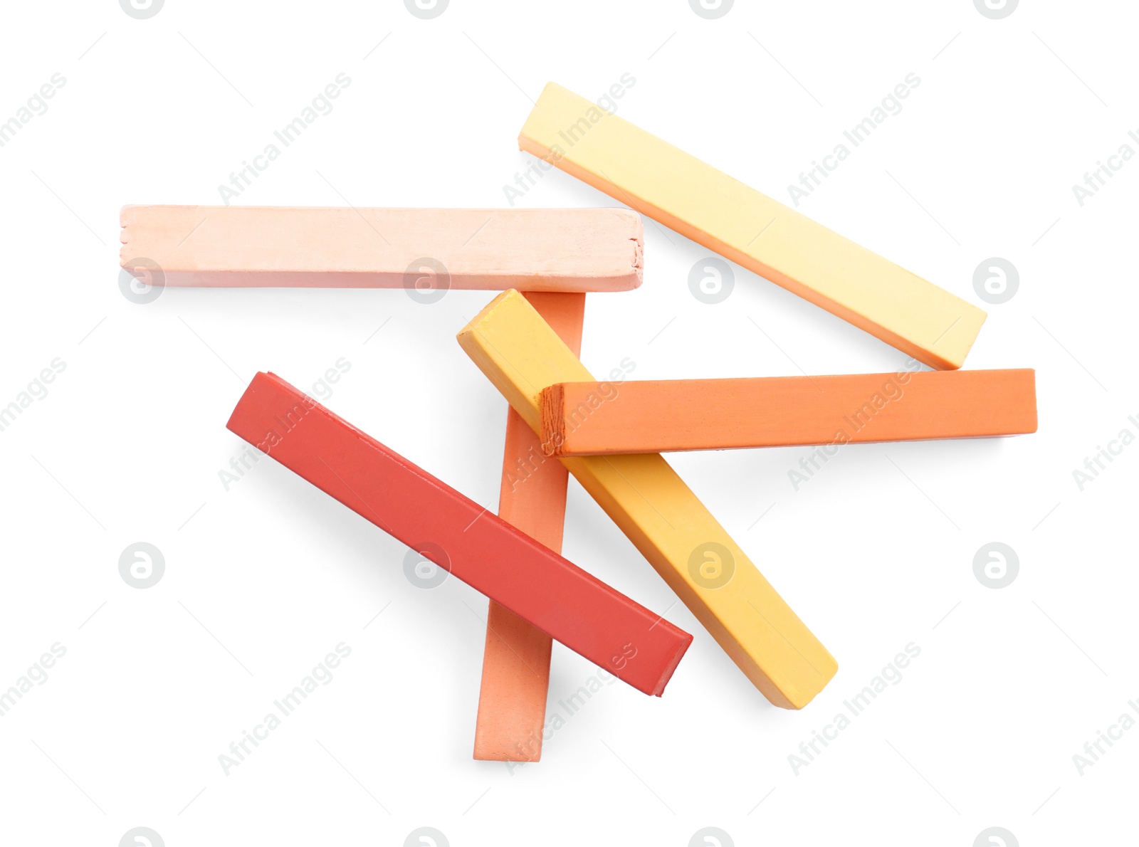 Photo of Colorful pastels on white background, top view. Drawing materials