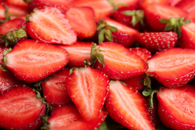 Photo of Many tasty ripe strawberries as background, closeup