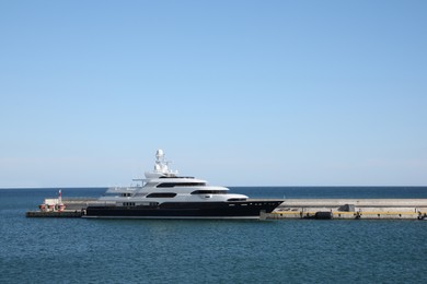 Modern ferry in sea port on sunny day