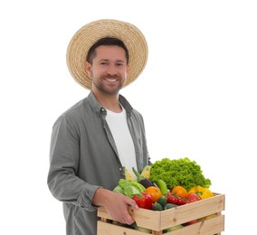 Harvesting season. Happy farmer holding wooden crate with vegetables on white background