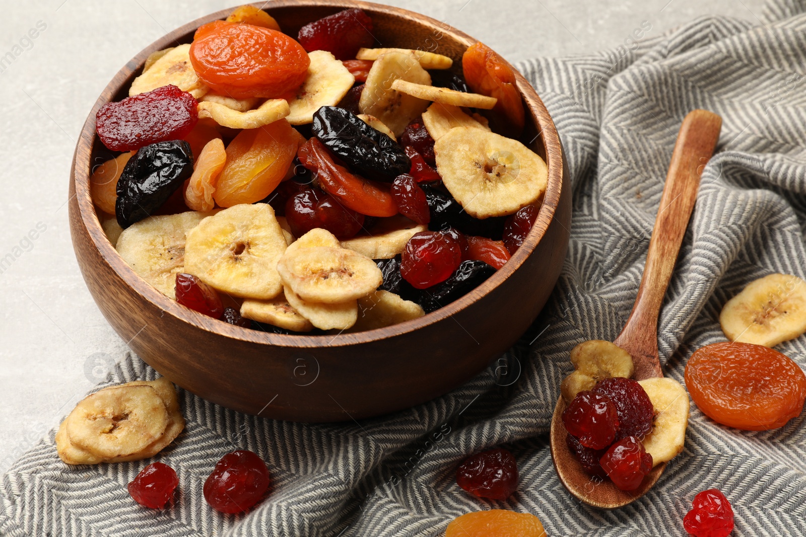 Photo of Mix of delicious dried fruits on table, closeup