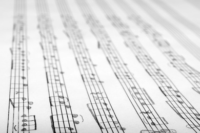 Photo of Sheet with music notes as background, closeup