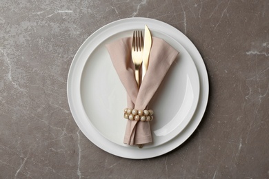 Photo of Elegant table setting on marble background, top view